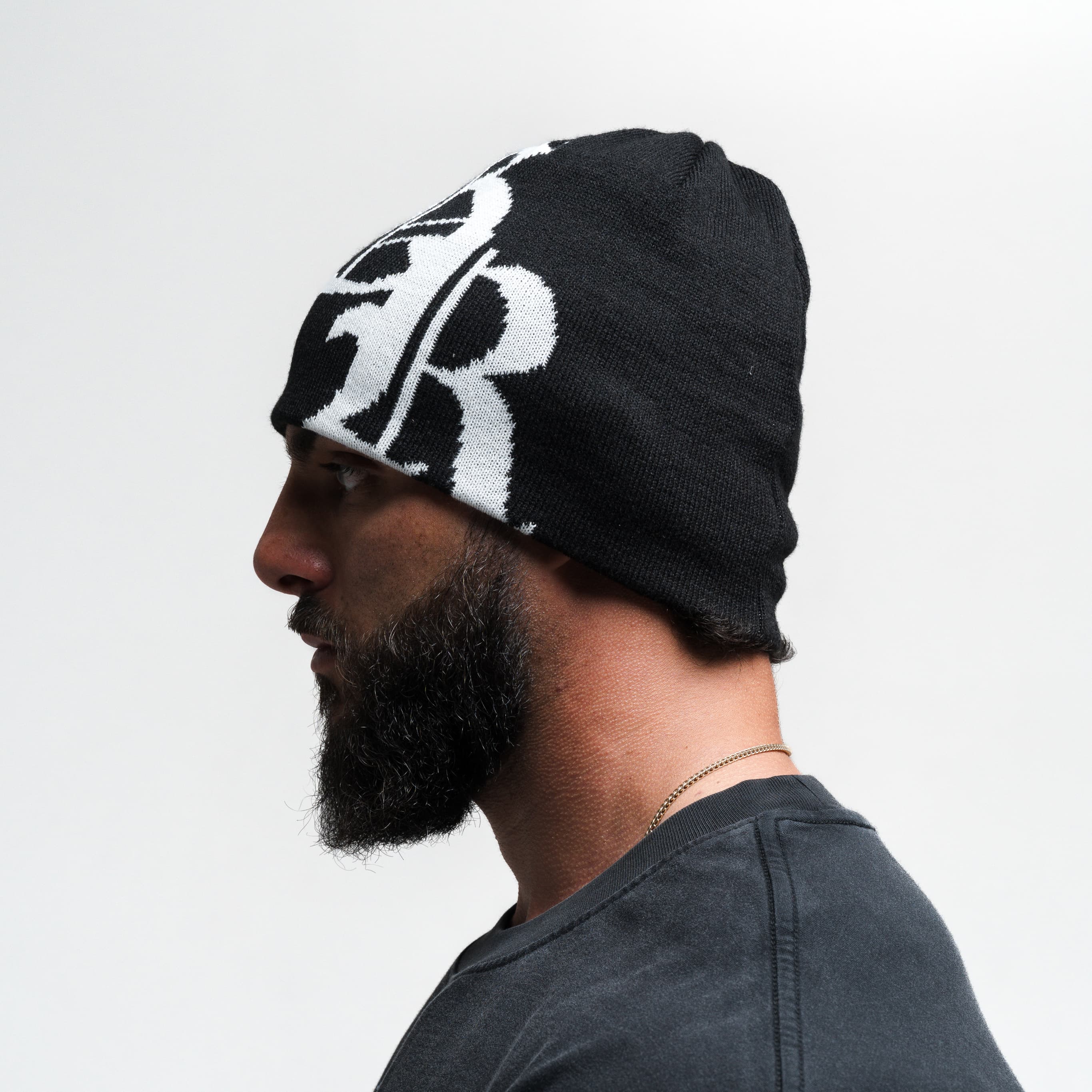Athlete wearing Initial Skull Cap Beanie - Black/White side view