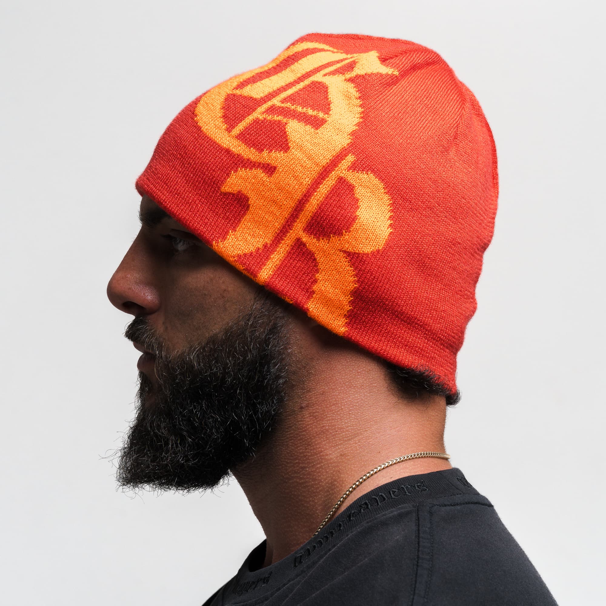 Athlete wearing Initial Skull Cap Beanie - Red/Orange side view