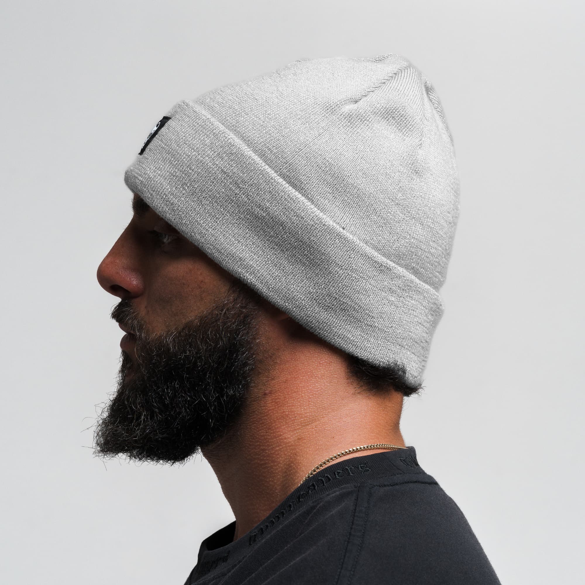 Athlete wearing Skull Knit Cuff Beanie - Slate side view