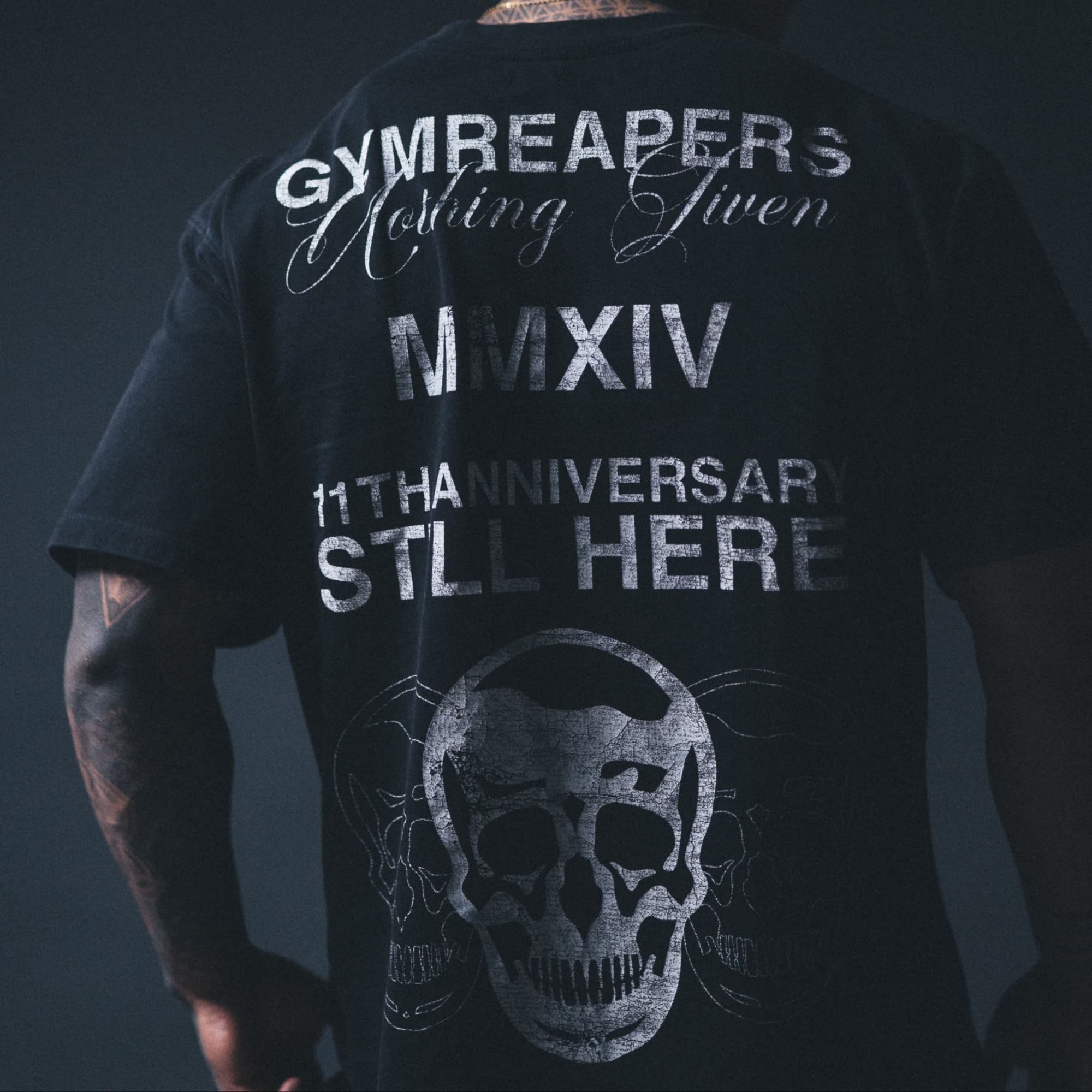 Lifestyle back shot of 11th anniversary tee on athlete.