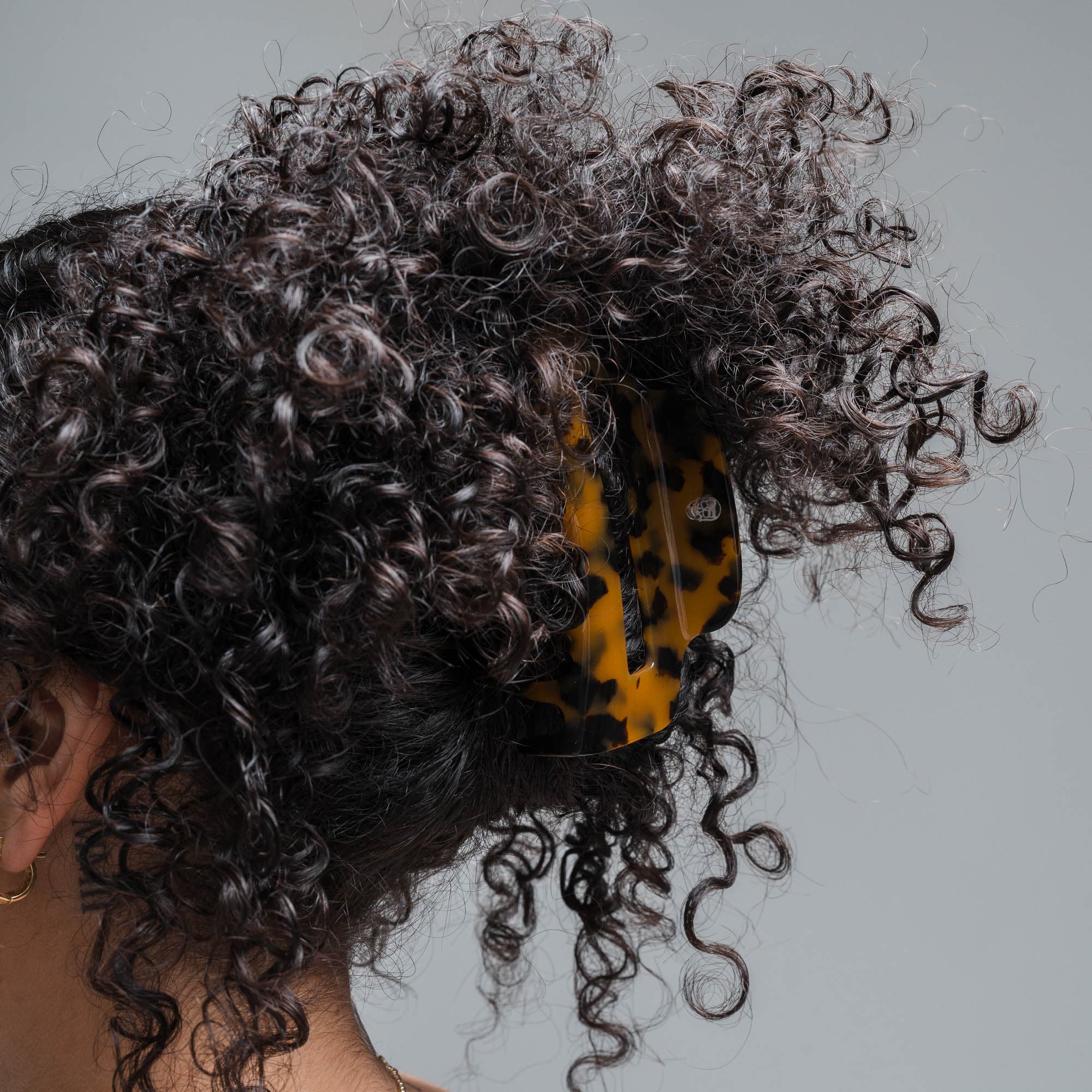 model wearing Large Claw Clip - Tortoise Shell Brown curly brown hair
