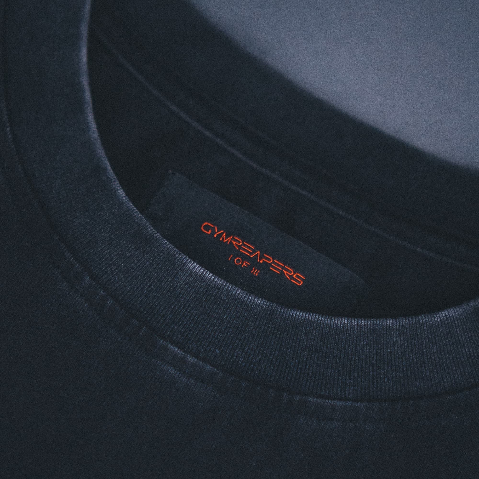 Close up shot of collar and tag on 11th anniversary tee.