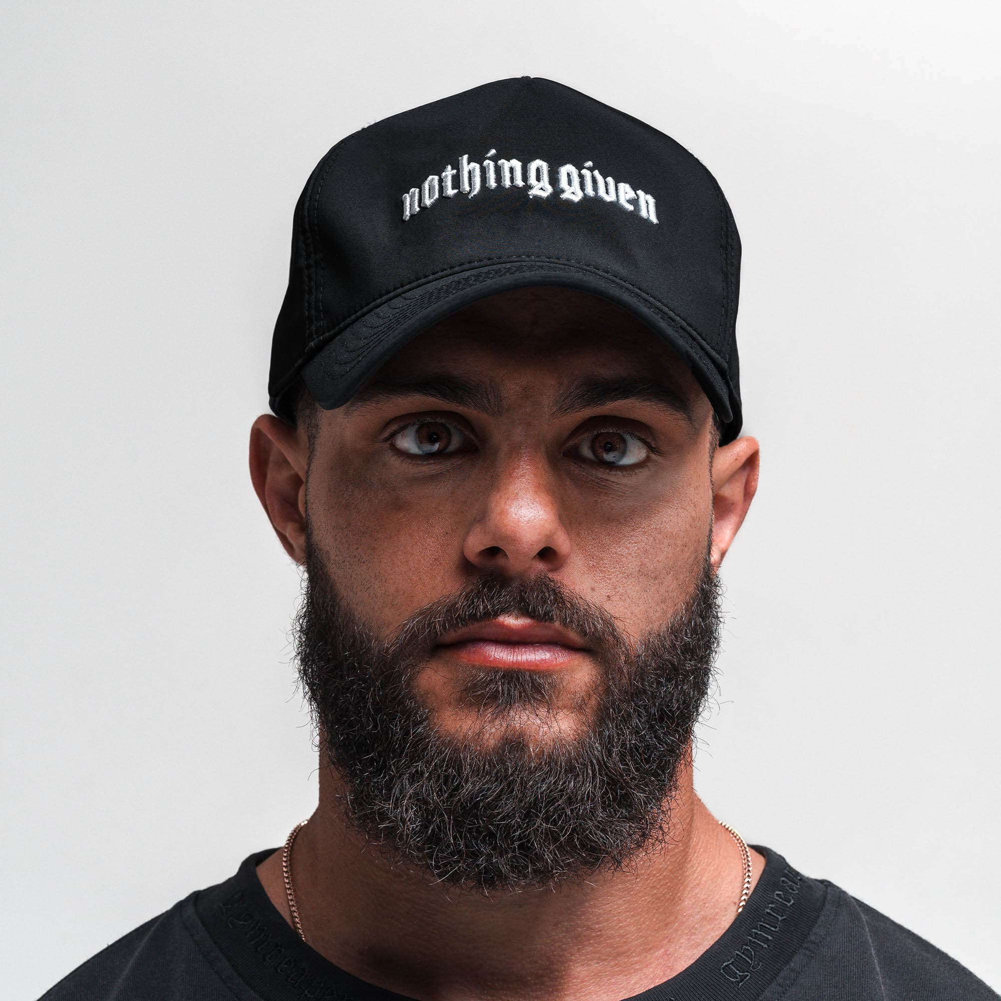 Athlete wearing Hybrid Performance Unstructured Hat - Nothing Given front view