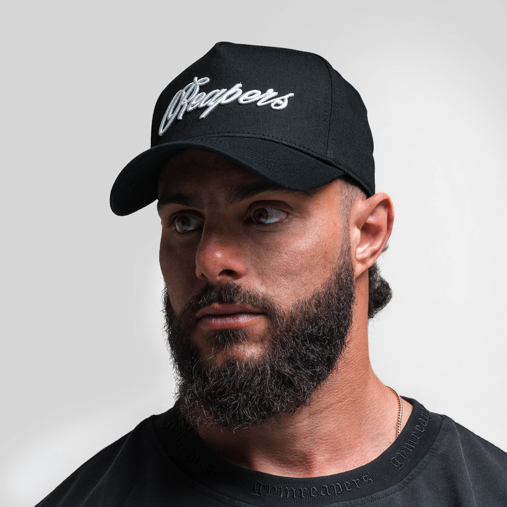 Athlete wearing Reapers 5-Panel Cotton Hat - Black/White front view