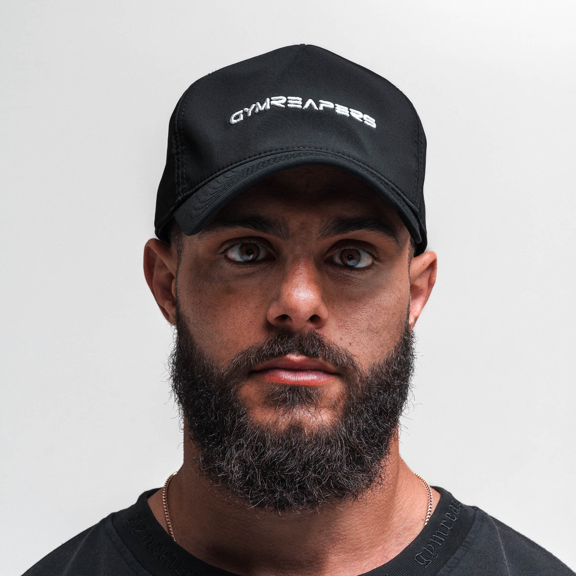 Athlete wearing Hybrid Performance Unstructured Hat - Gymreapers front view