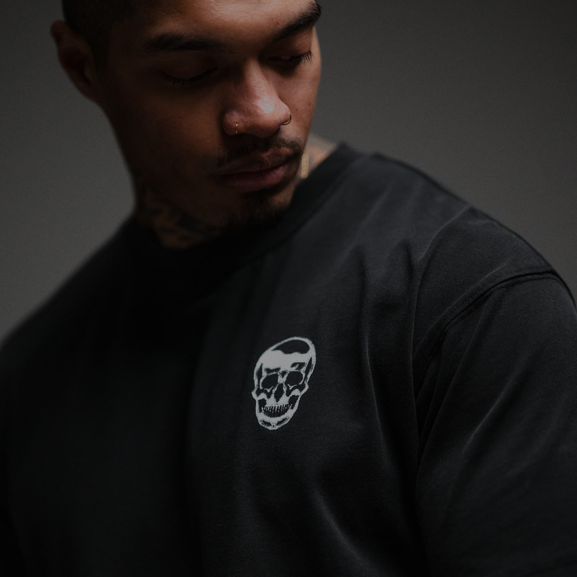 Athlete wearing 12th Anniversary Tee - Ride or Die close up shot of front logo