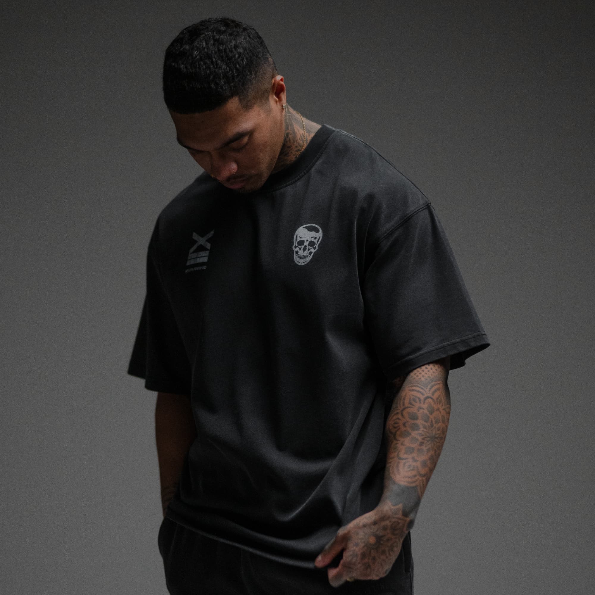 Athlete wearing 12th Anniversary Tee - Never Finished half body shot front view