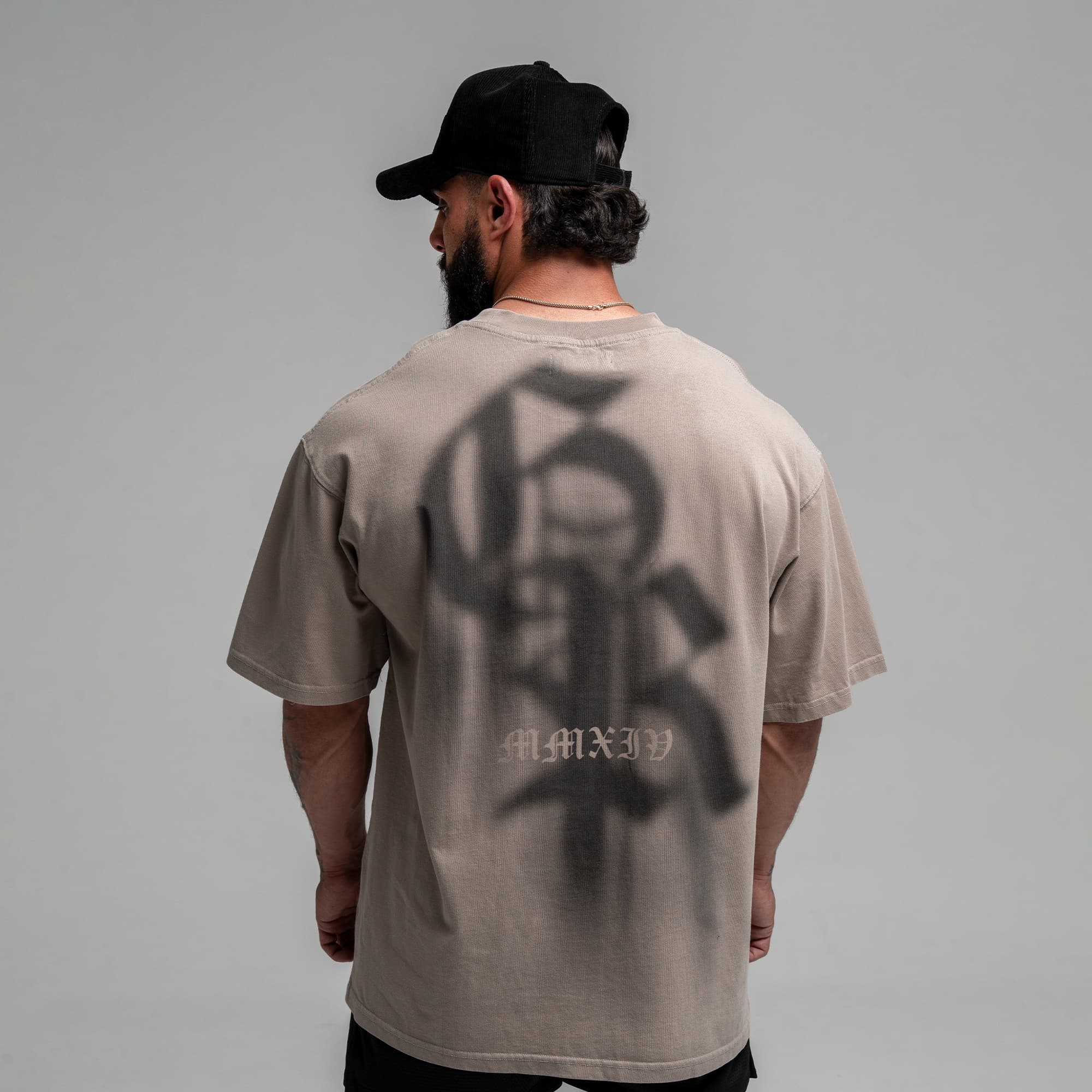 Athlete wearing GR Shadow Tee half body shot back view
