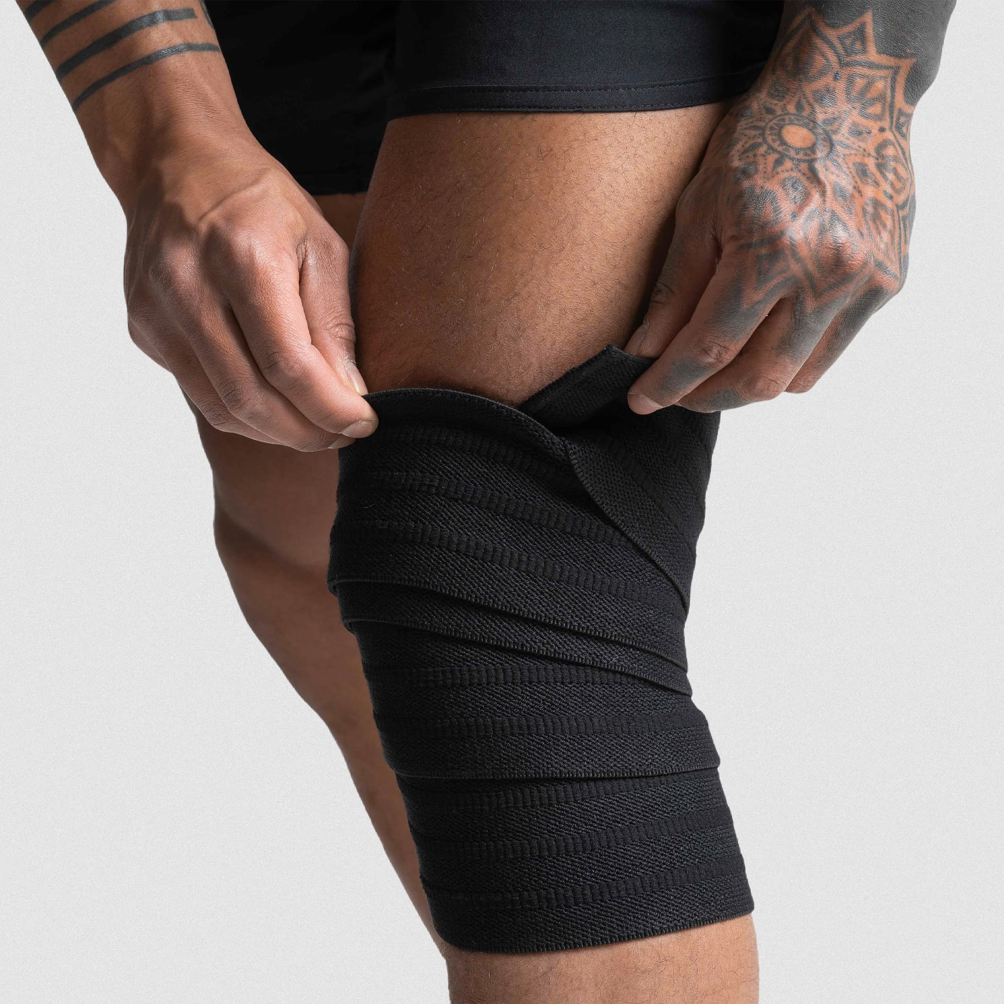 heavy duty knee wraps being applied