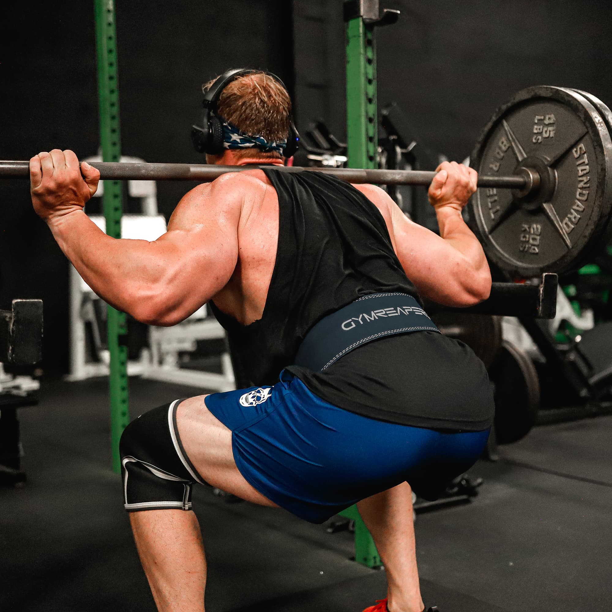Athlete squatting with the 10mm Navy Lever Belt