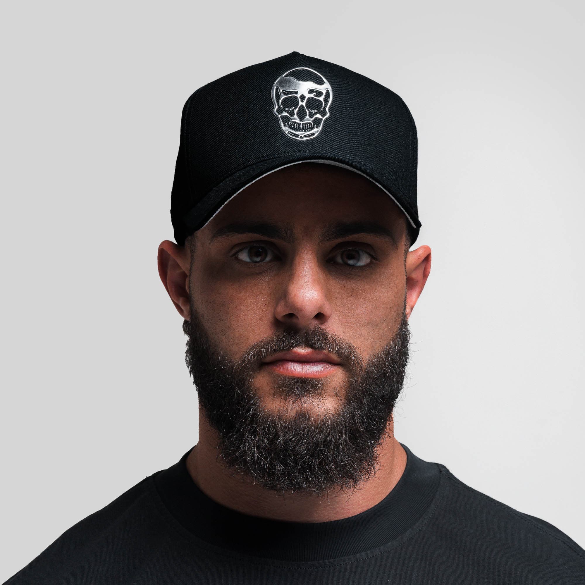 Athlete wearing 5-Panel Chrome Skull Hat front view