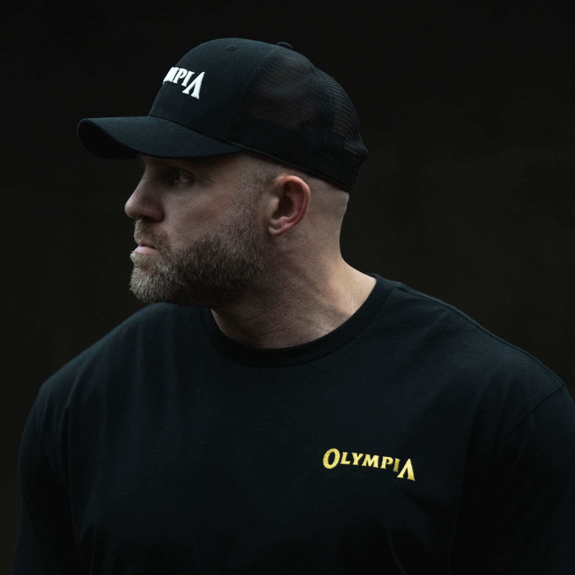 Olympia Trucker Hat on athlete side view