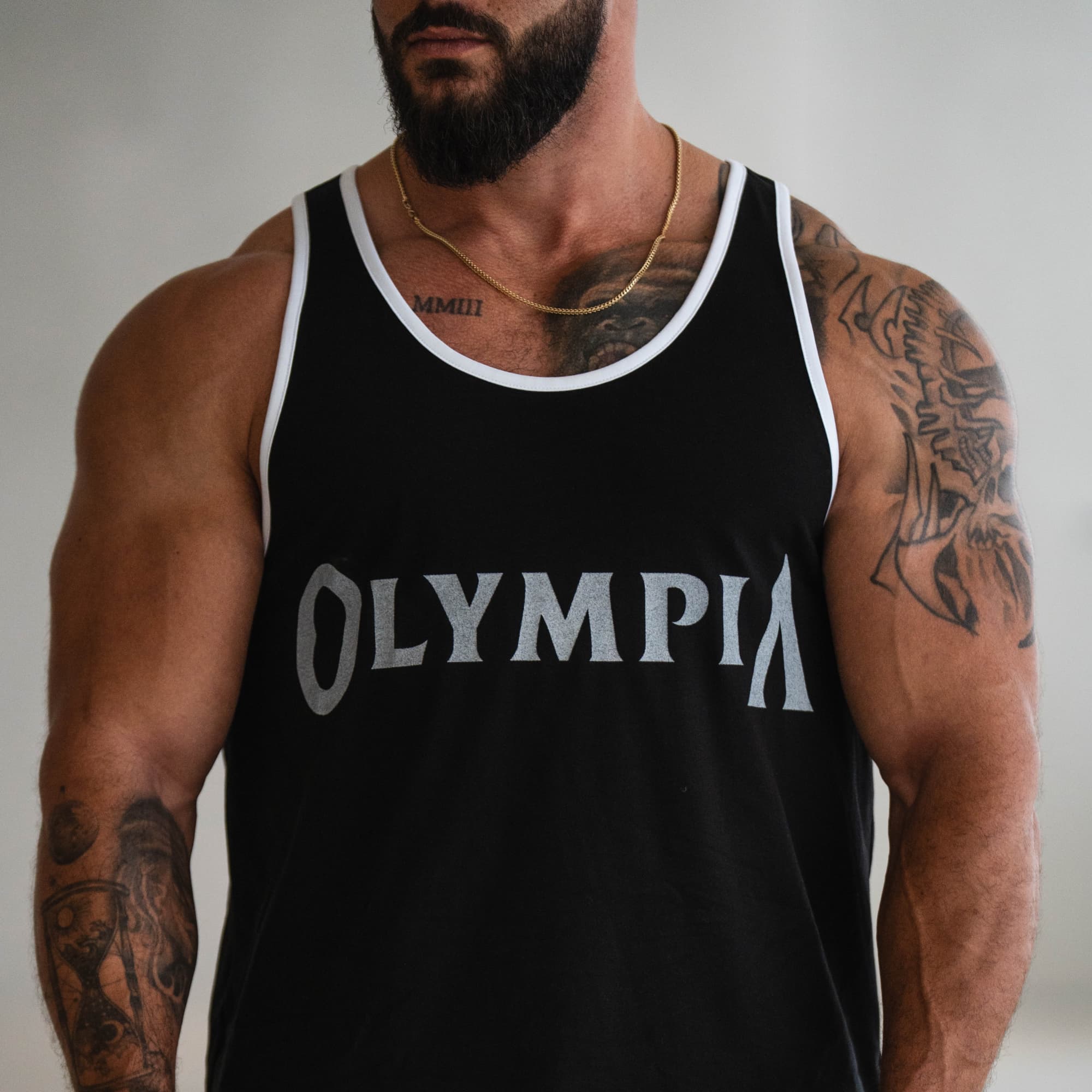 Close-up of the Bound Edge Classic Olympia Stringer on model highlighting chest logo and white edging.