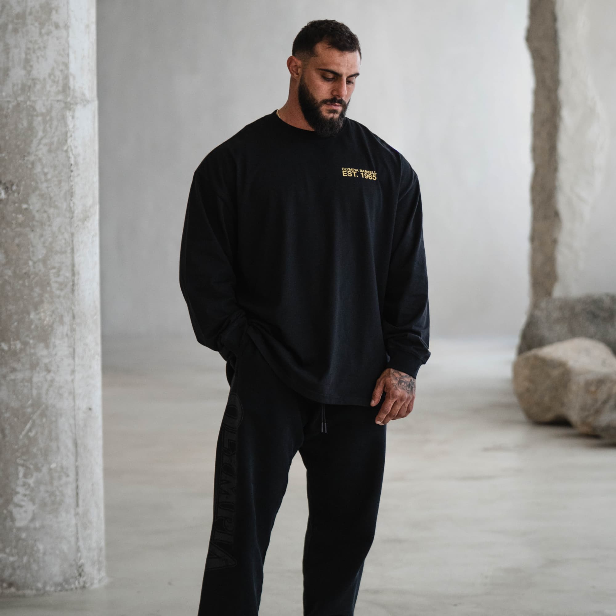 lifestyle shot of athlete wearing the crest long sleeve shirt showcasing front graphic