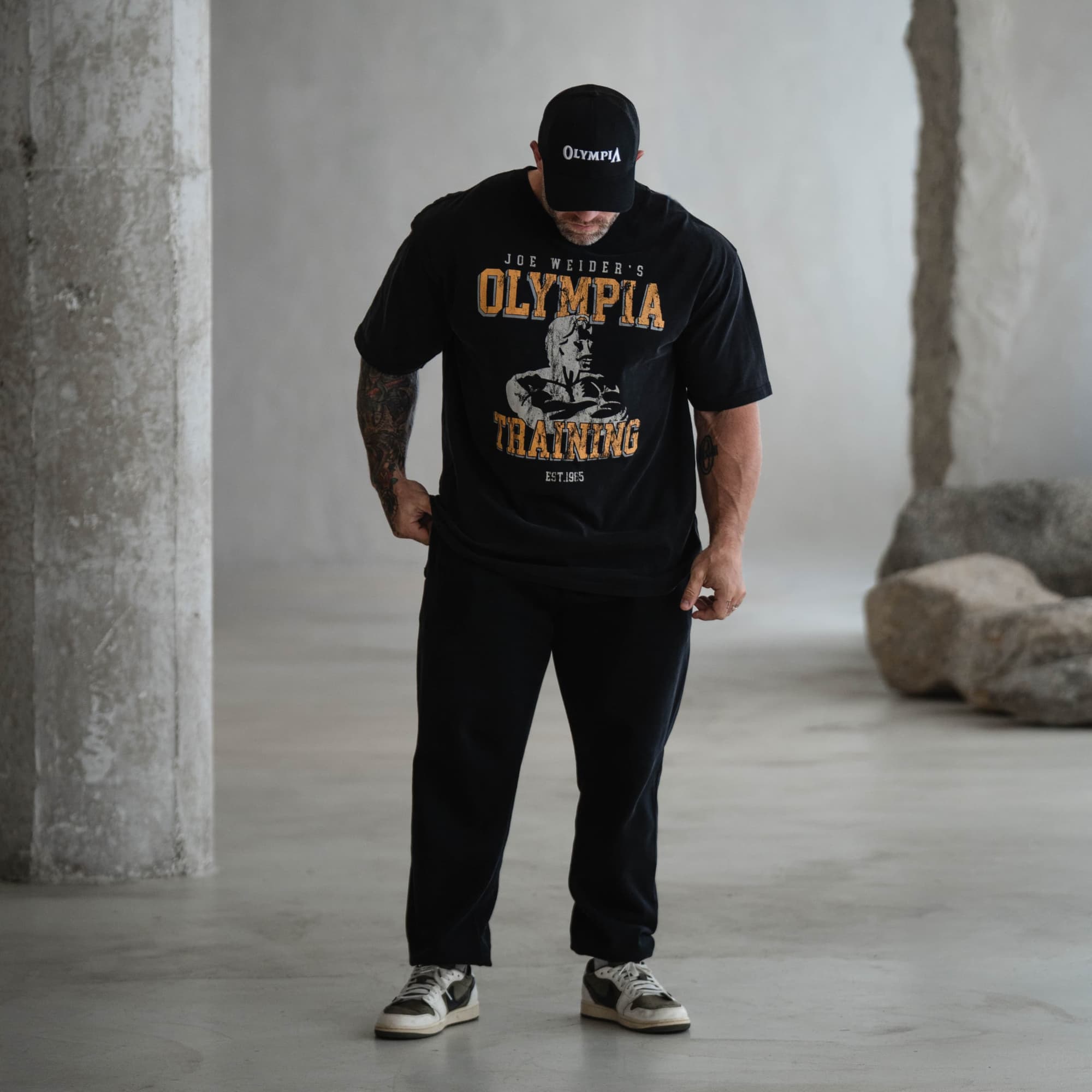 full body lifestyle shot of athlete wearing olympia training tee