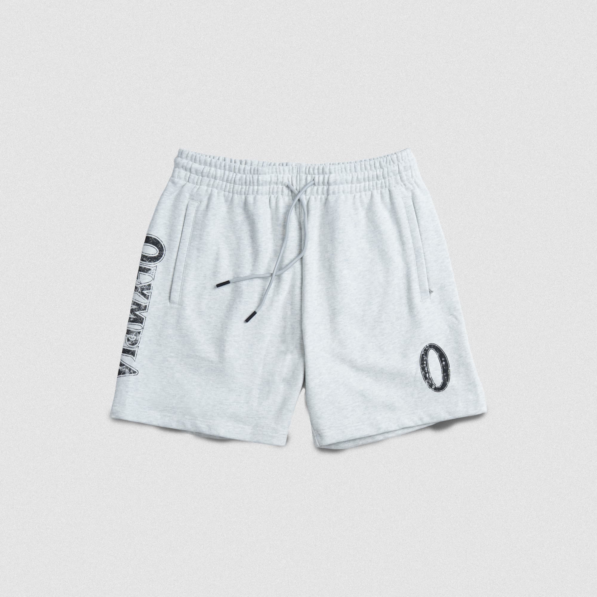 Flat lay front view of the Olympia Sweat Short in light grey, featuring a vertical “Olympia” graphic on the right leg and oval wreath logo on the left leg.