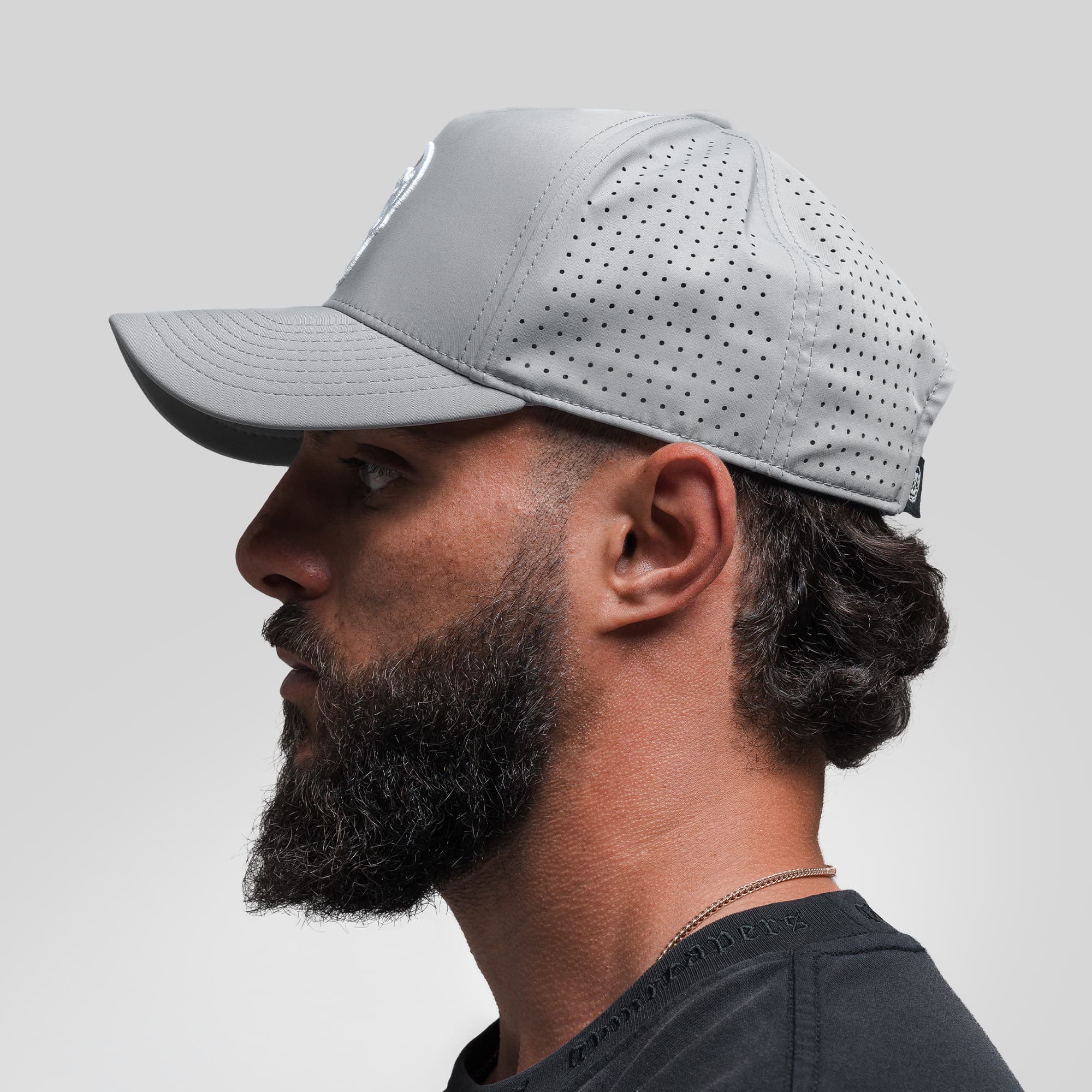 Athlete wearing Hybrid Performance 5-Panel Hat - Gray/White side view