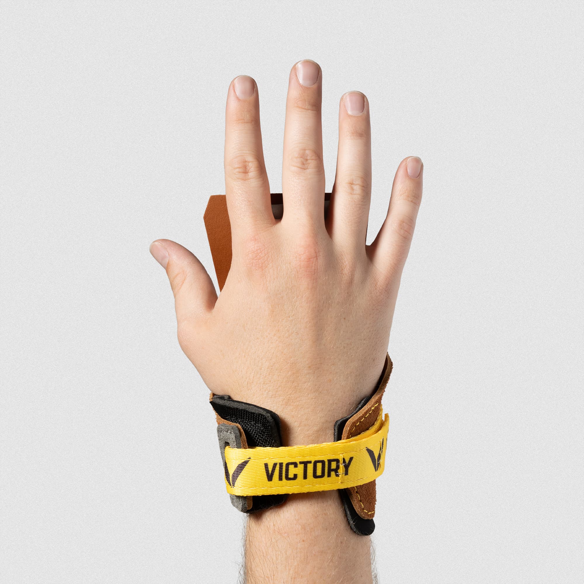 Men's V-Series Freedom Leather in Tan –  Hand extended and palm facing away to show the hook and loop closure wrist design 
