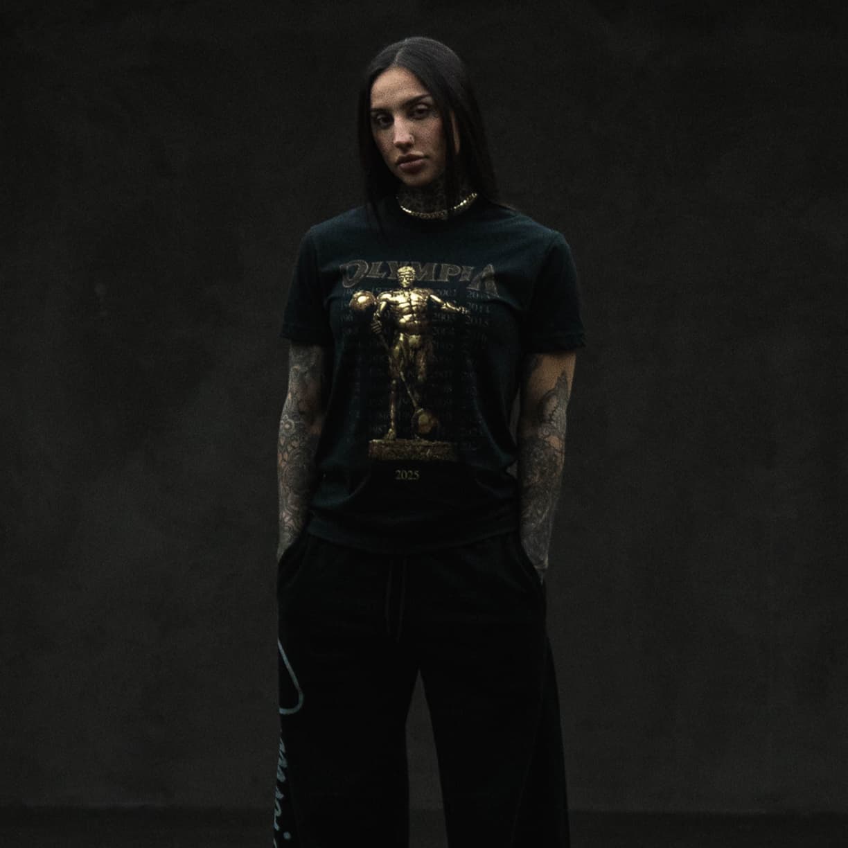 full body lifestyle shot of athlete wearing the sandow legacy tee