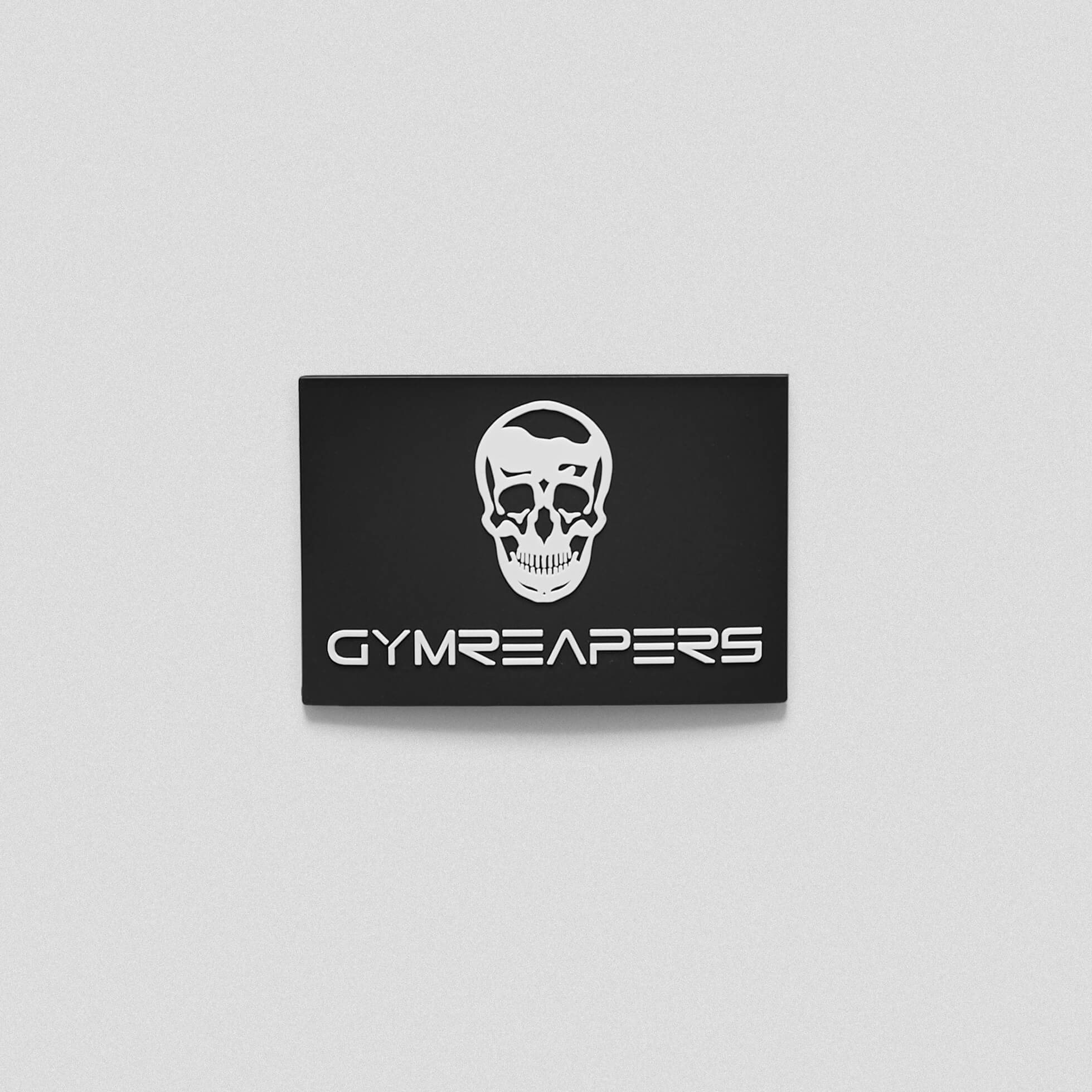 A black white patch with the Gymreapers skull and text in the middle.