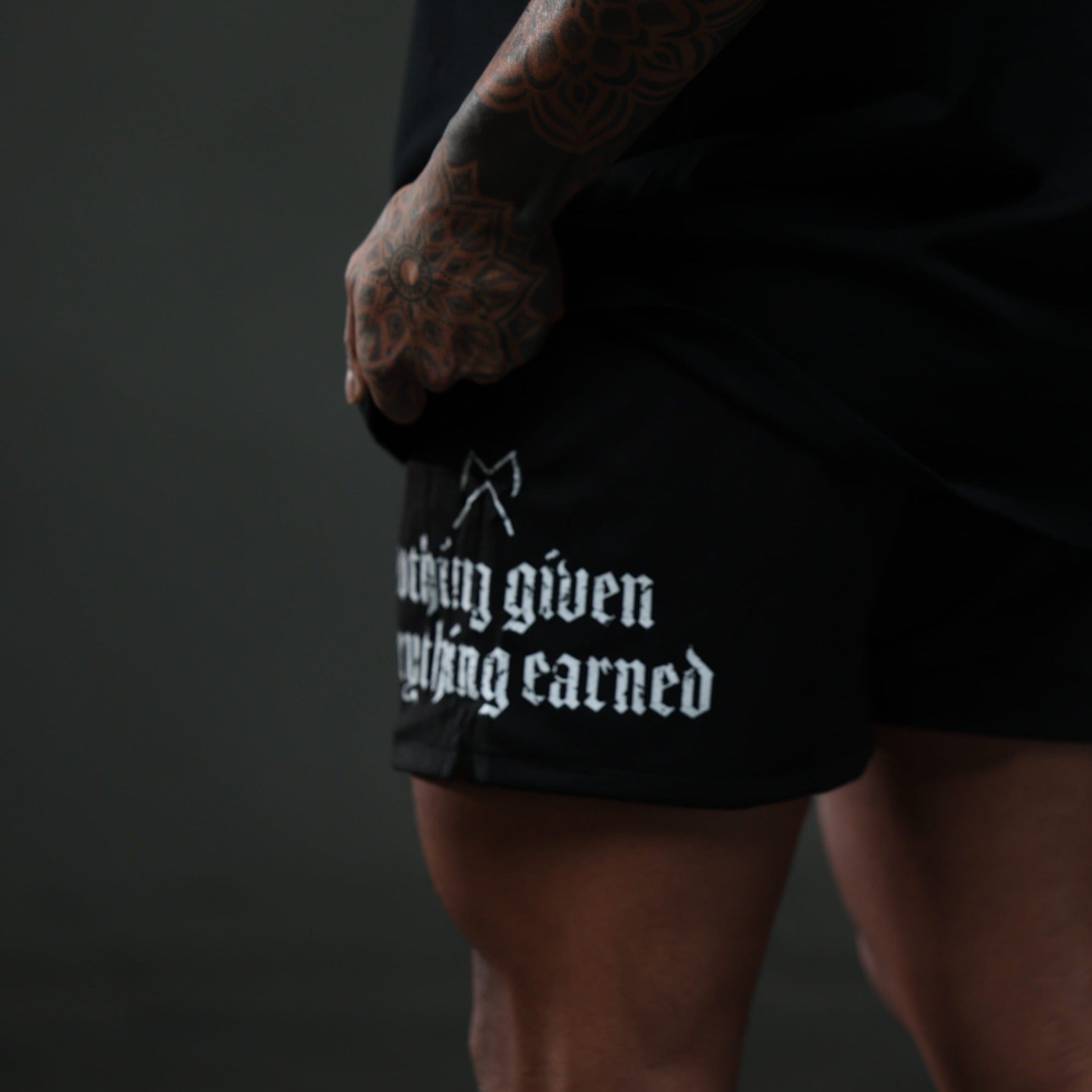 mantra shorts black white studio close up