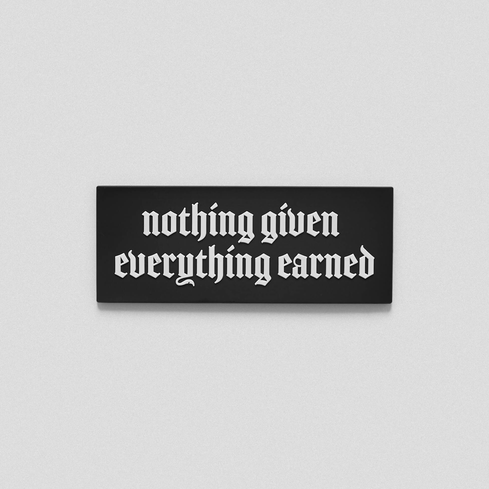 A black white patch that says nothing given everything earned across the middle.