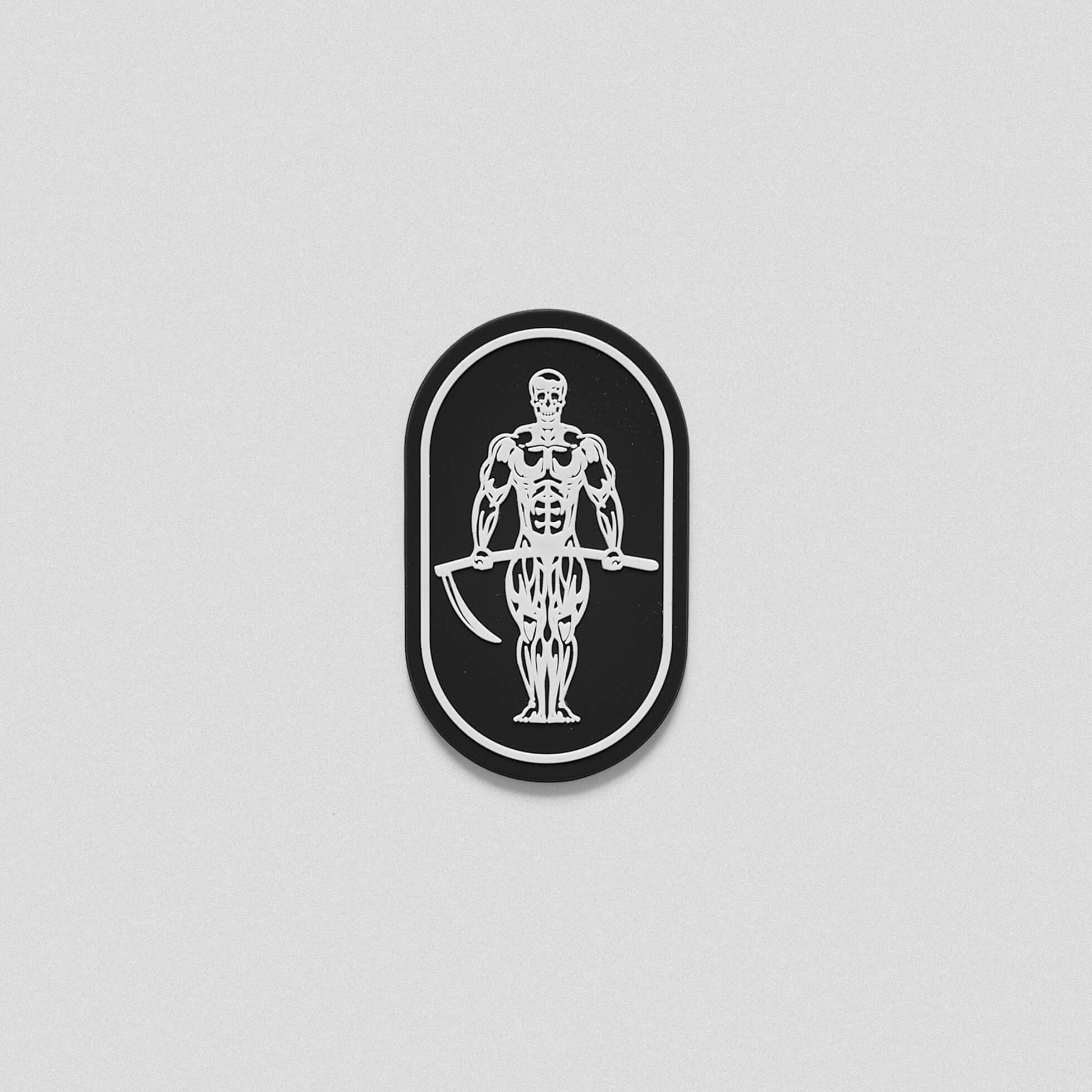 A black and white patch with a skeleton holding a scythe.