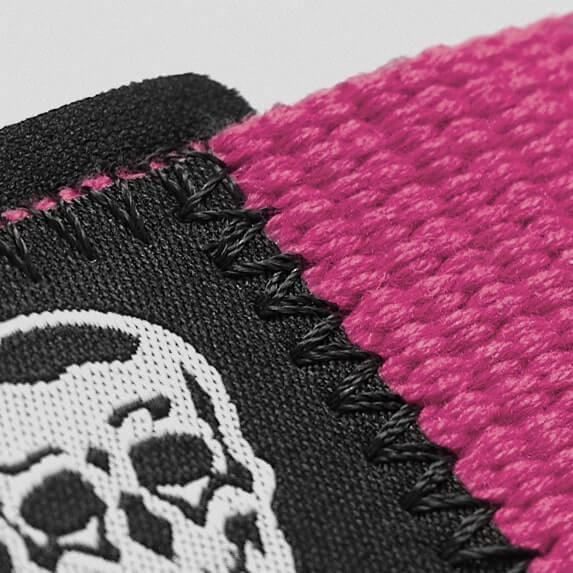 pink lifting straps skull close up