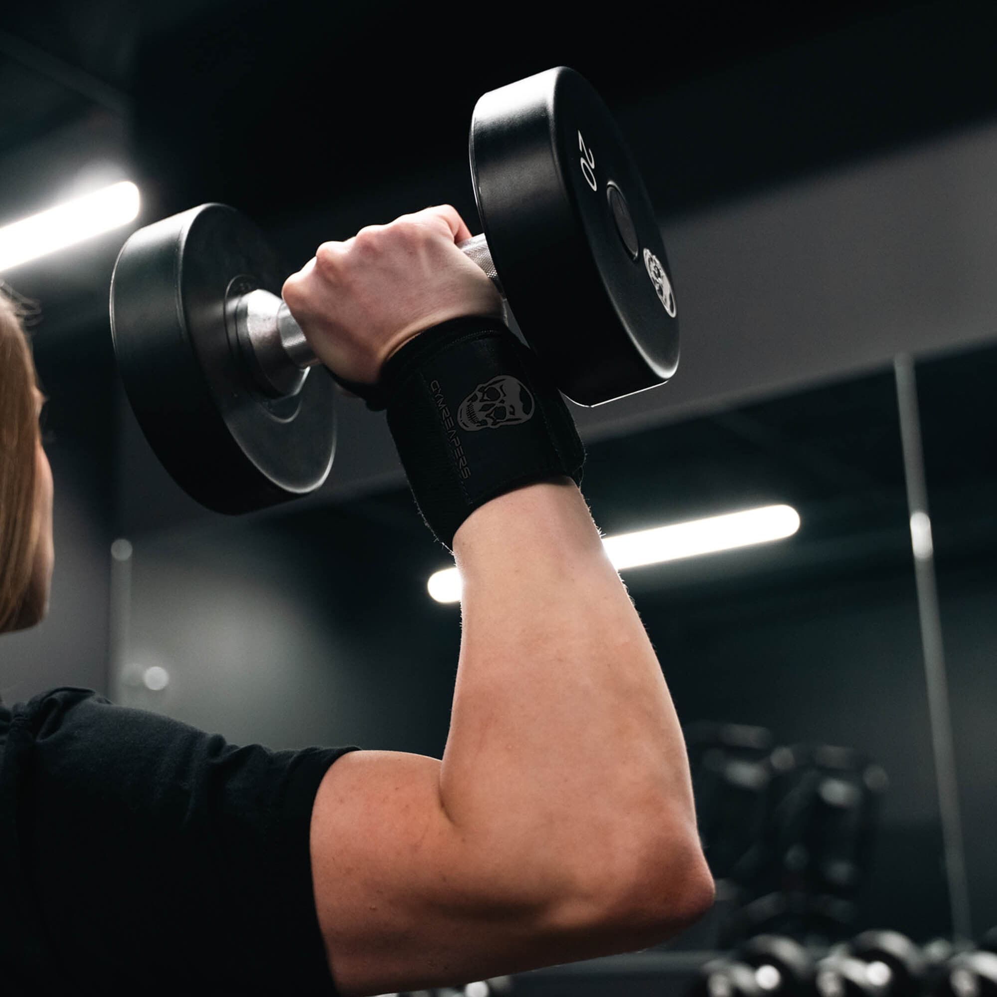 Athlete wearing black black wrist wraps.
