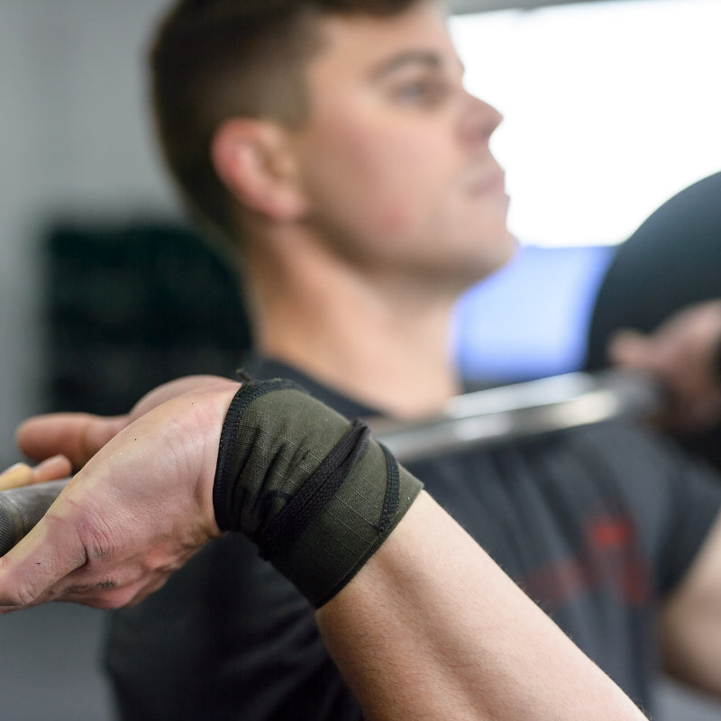 Gymreapers strength wraps being tested while lifting